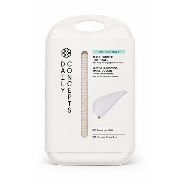 After-shower hair towel with walnut button fastening, shown with its sugarcane pulp packaging.