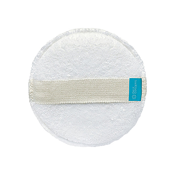 Round white cleaning pad with a blue label on a white background
