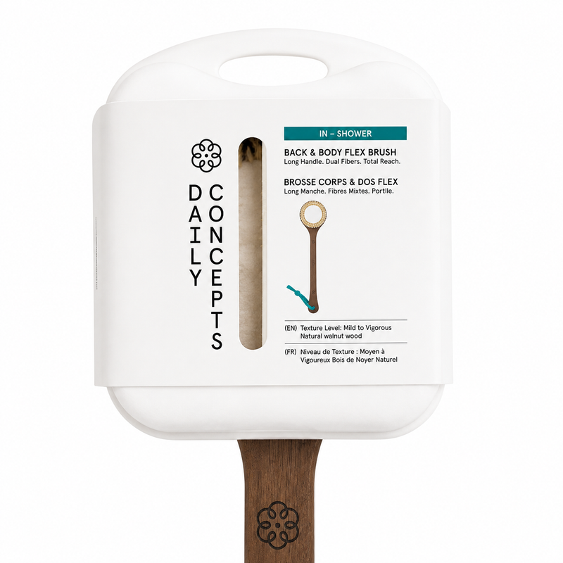 A Daily Concepts in-shower back and body flex brush with a white plastic handle and a natural wood bristle head, shown against a plain white background.