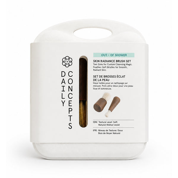 Two-piece facial cleansing brush set with walnut handles and soft nylon bristles.