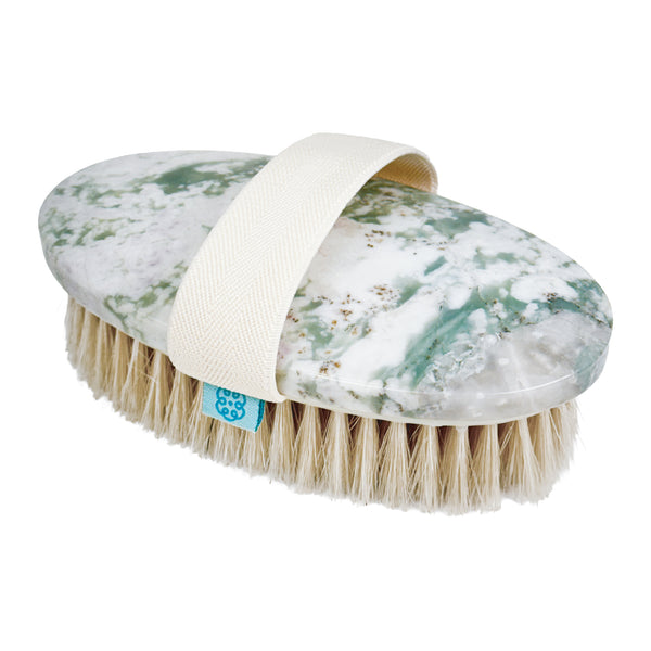 An oval-shaped natural body brush with a green and white serenity stone head, a cream fabric handle strap, and natural beige bristles, shown on a white background.